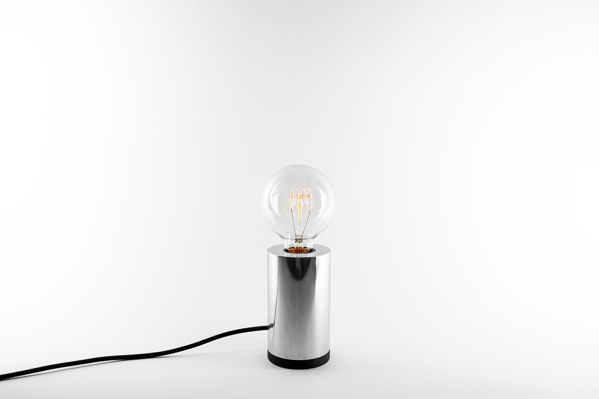 Dimmable bedside lamp in silver color with vinatge Edison bulb inapired by scandinavian design