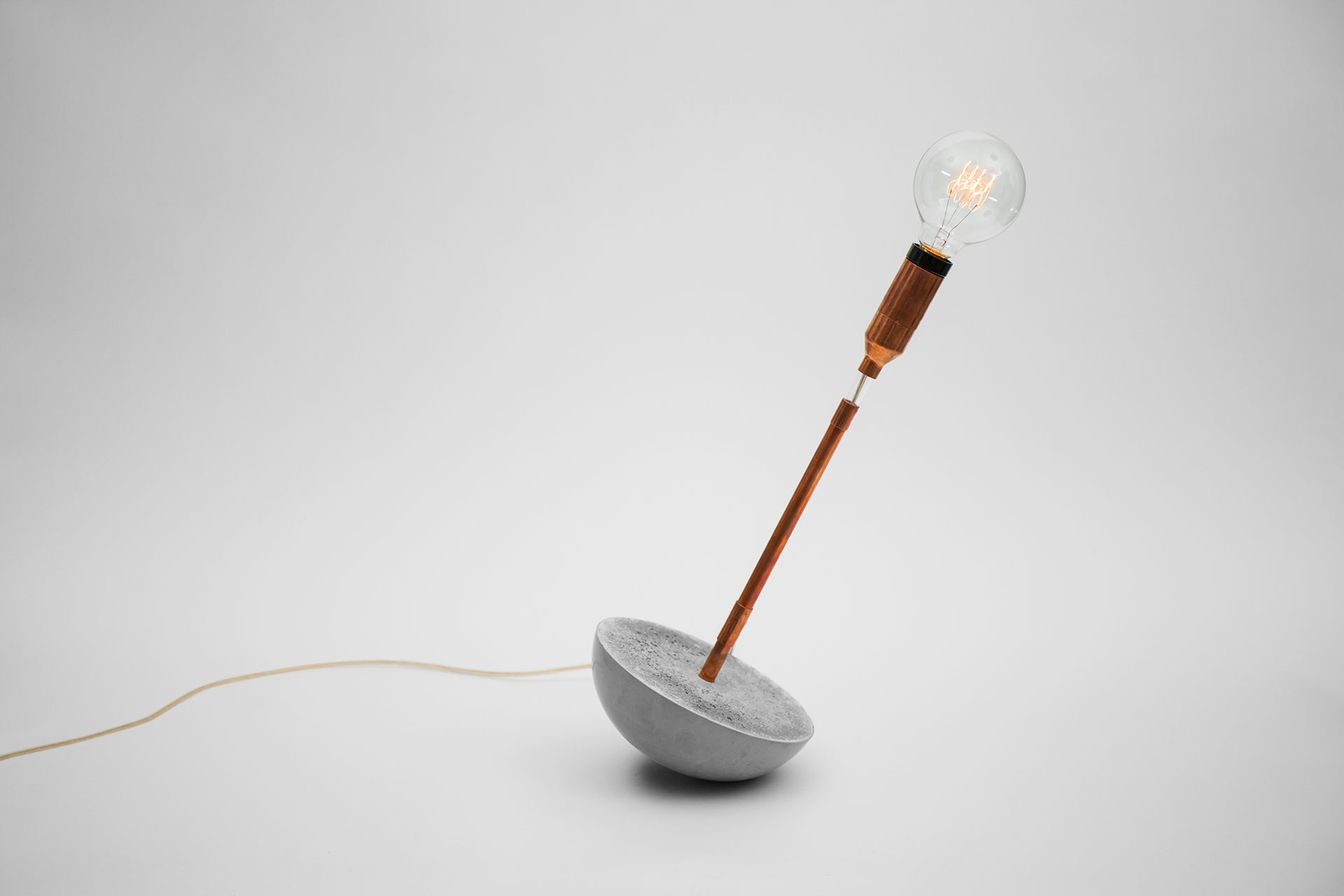 Fun design table lamp with magic touch dimmer and concrete base inspired by soviet era roly-poly toy