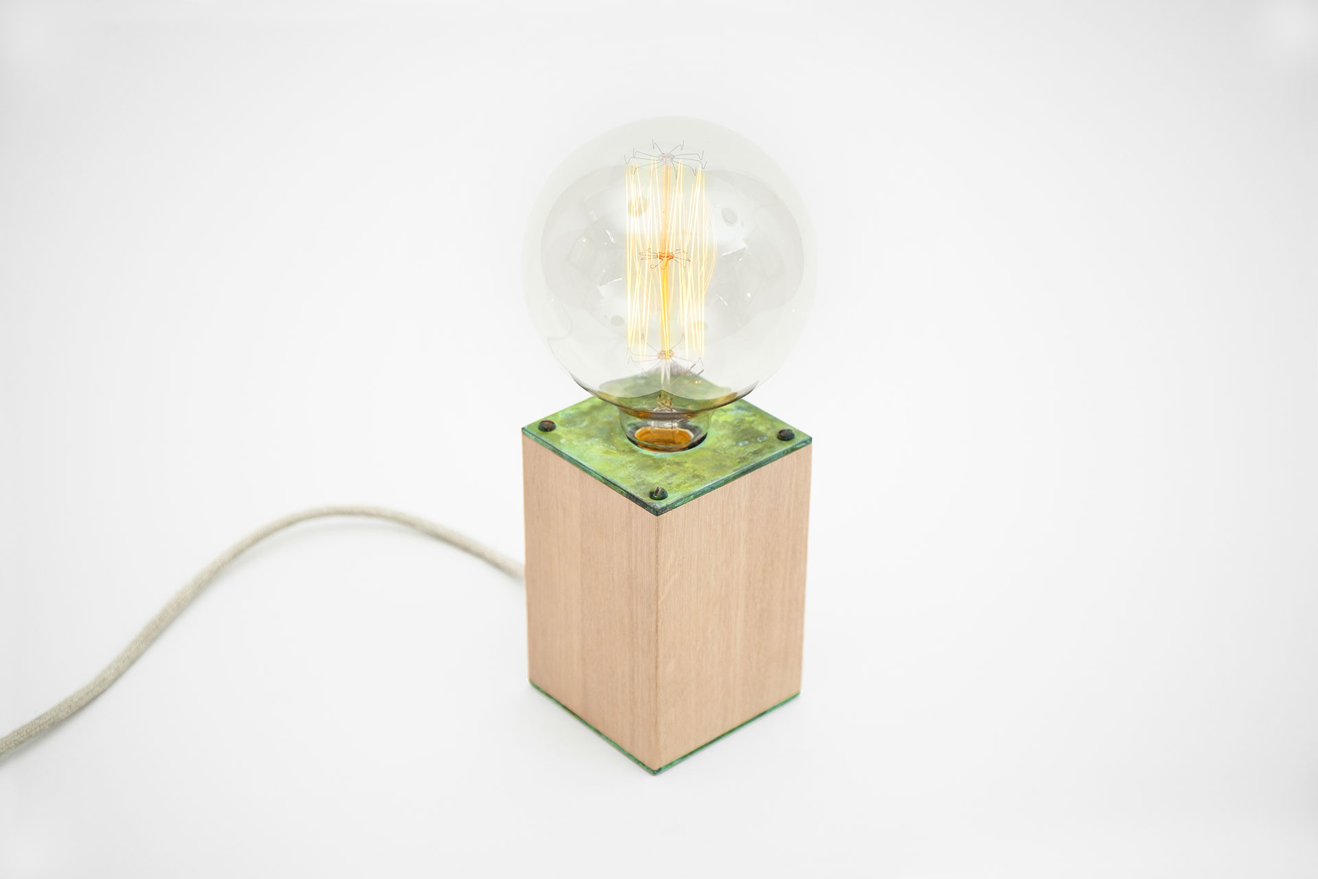 Colorful table lamp in natural oak wood and handmade green patina with magic touch dimmer and large retro bulb