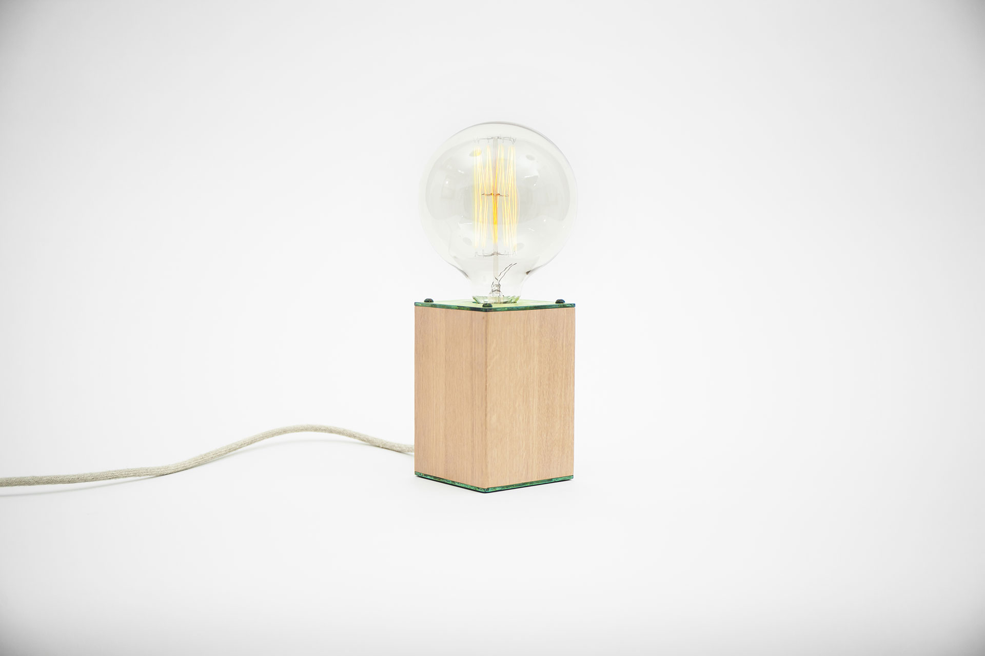 Scandinavian design bedside lamp in natural oak wood and fashionable green patina with touch dimmer and retro bulb