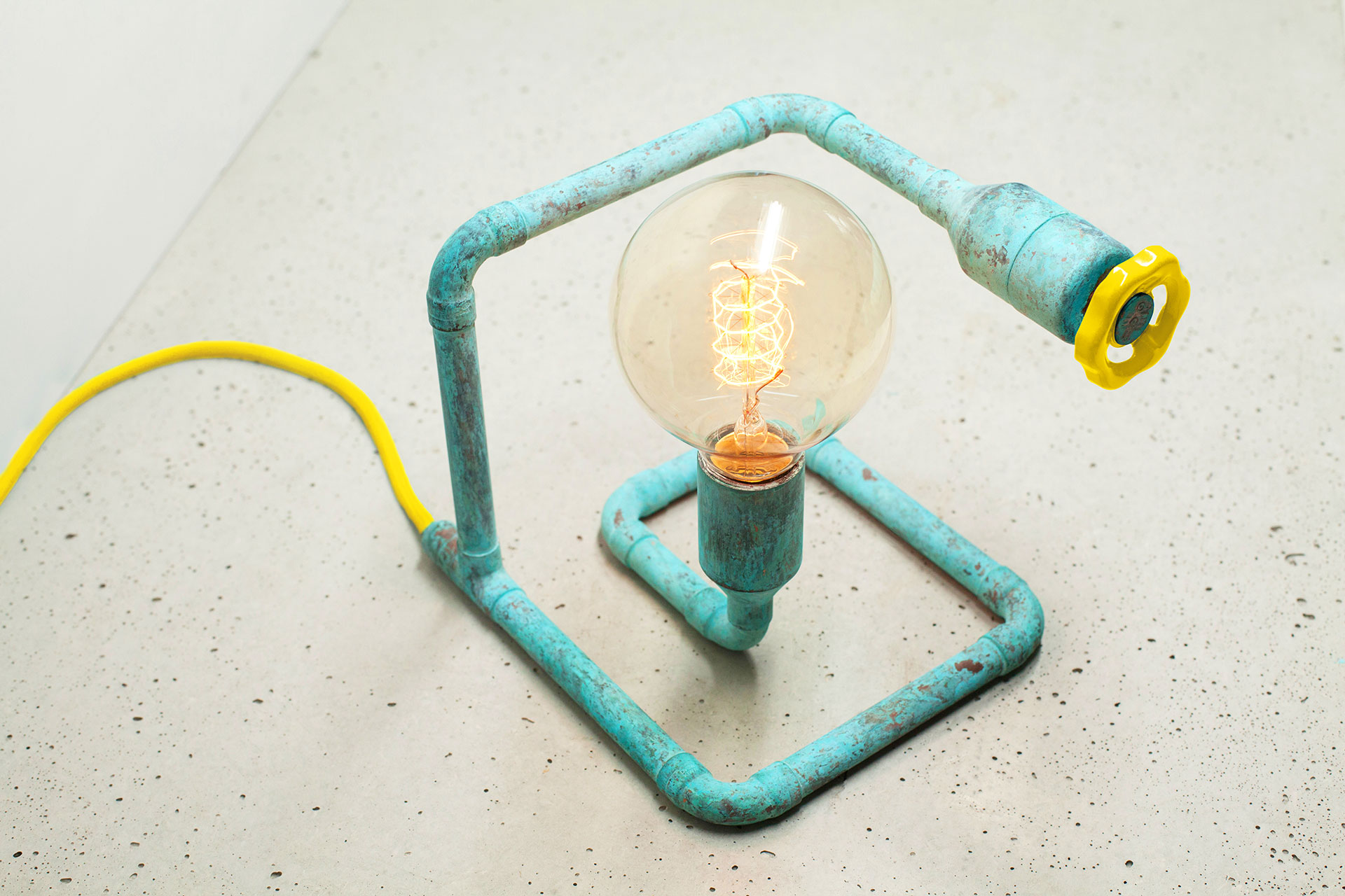 Colorful table lamp in trendy turquoise patina with yellow knob dimmer and yellow braided cord
