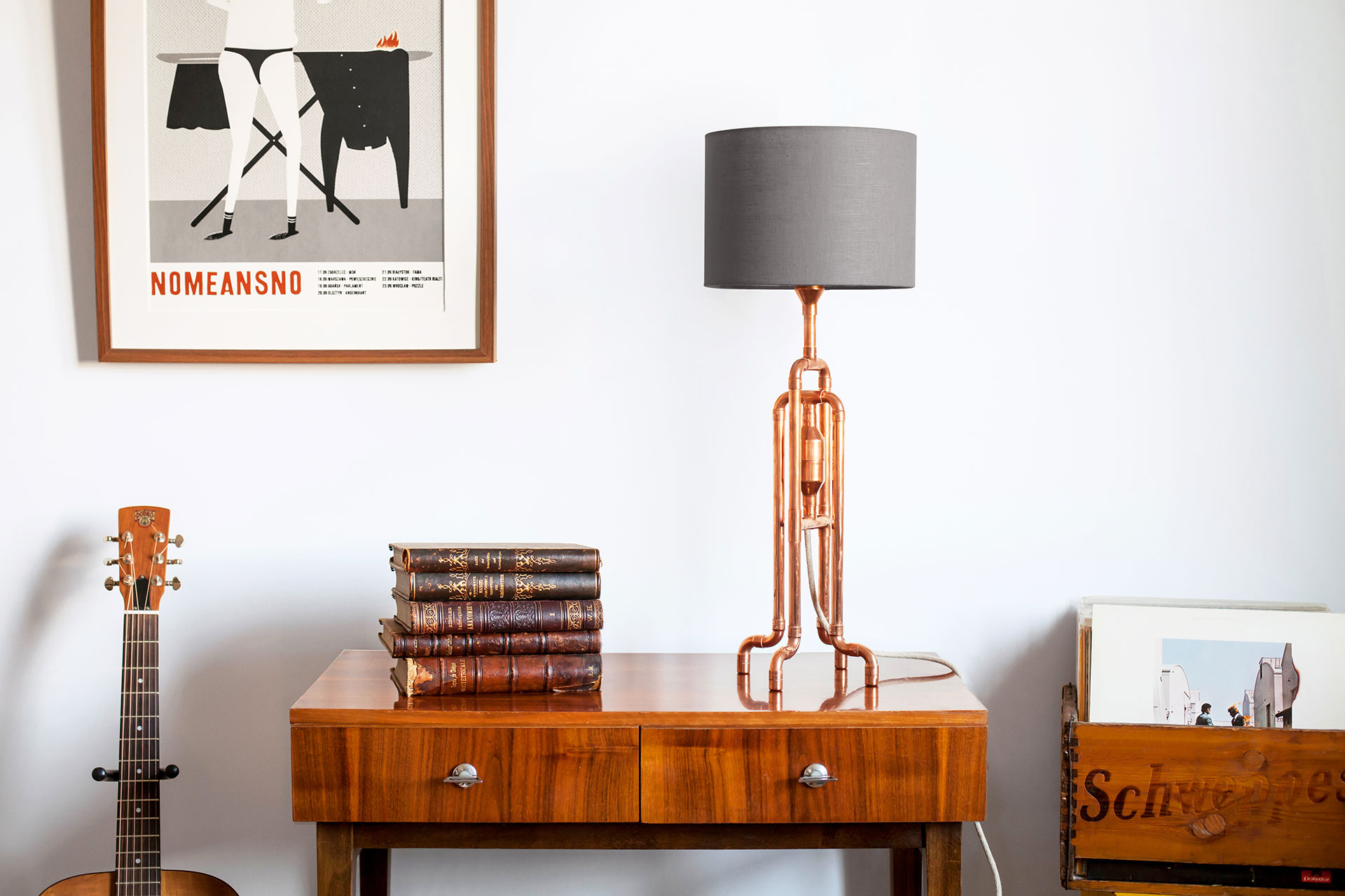 Copper tubing console lamp with grey linen shade inspired by industrial design in hipster apartment