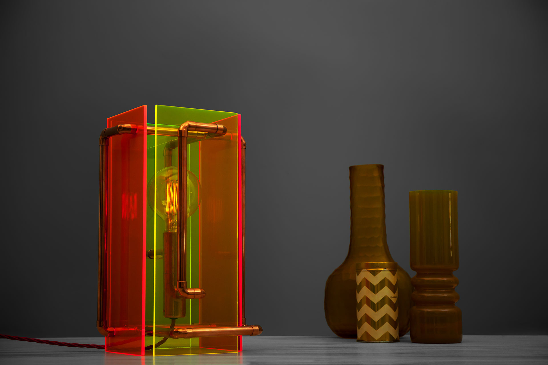Sculpture table lamp inspired by 80's colorful plastic design and modern industrial style