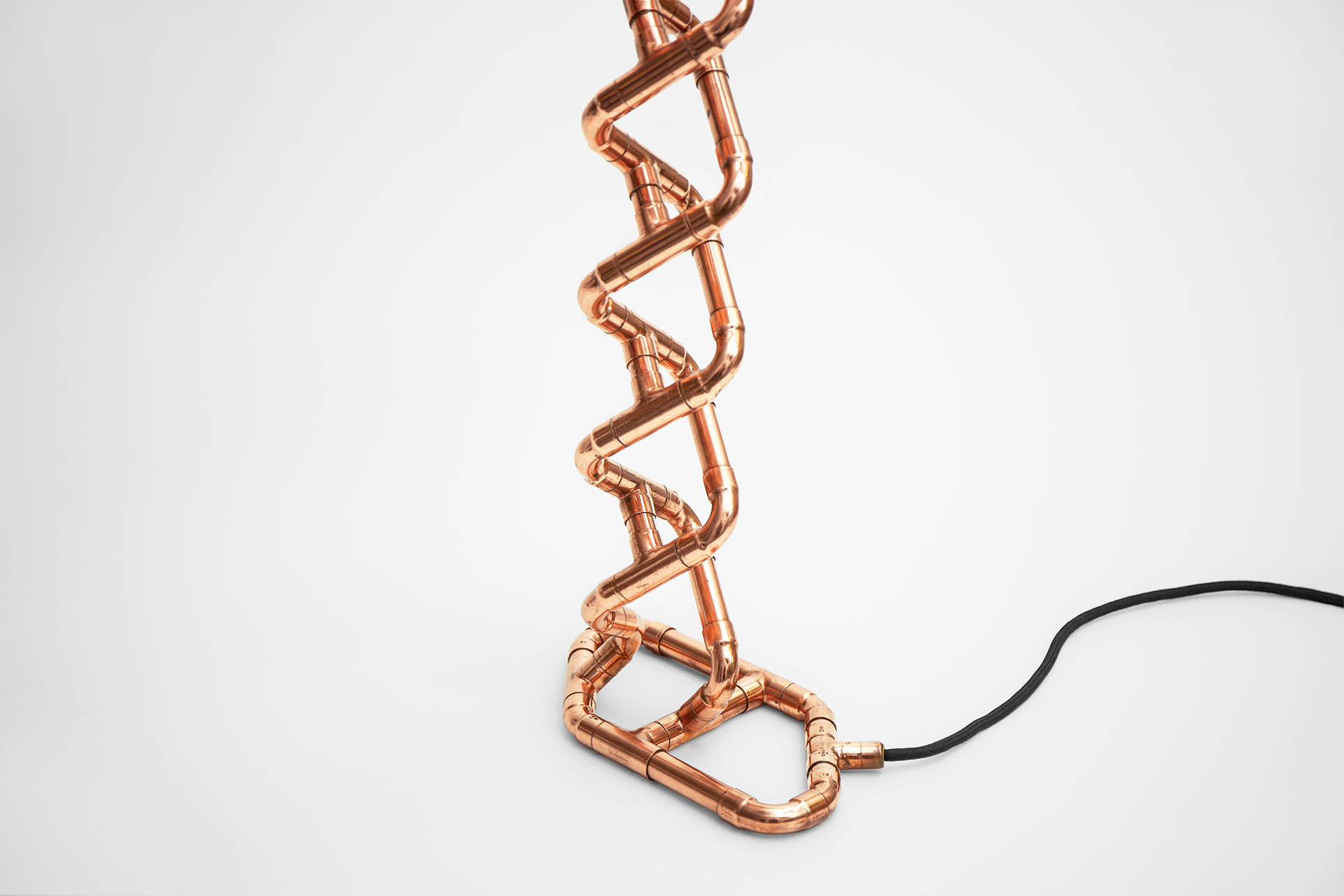 Copper pipe sculpture table lamp inspired by DNA double helix