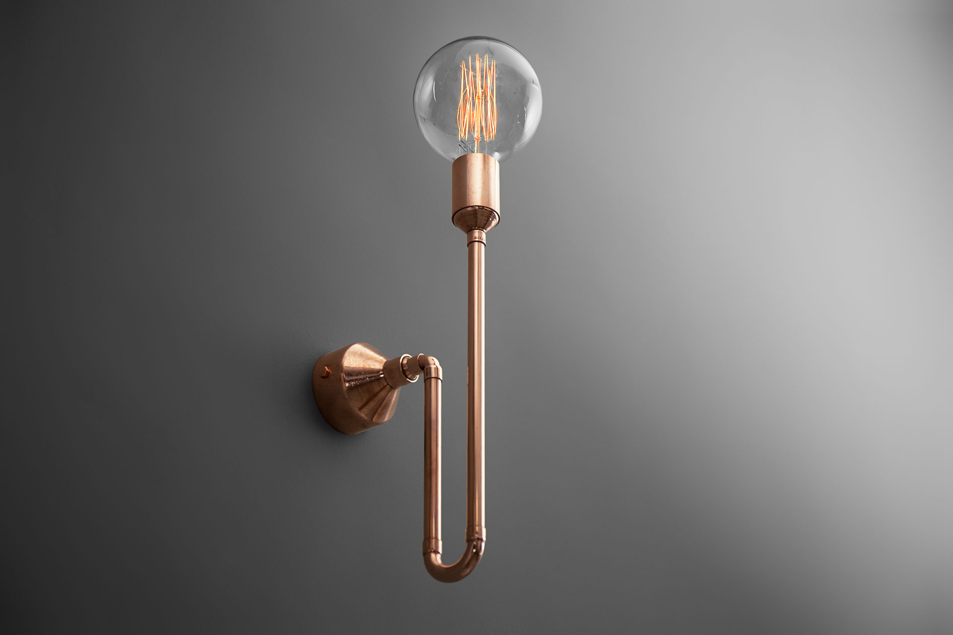 Industrial design copper sconce with large Edison style bulb