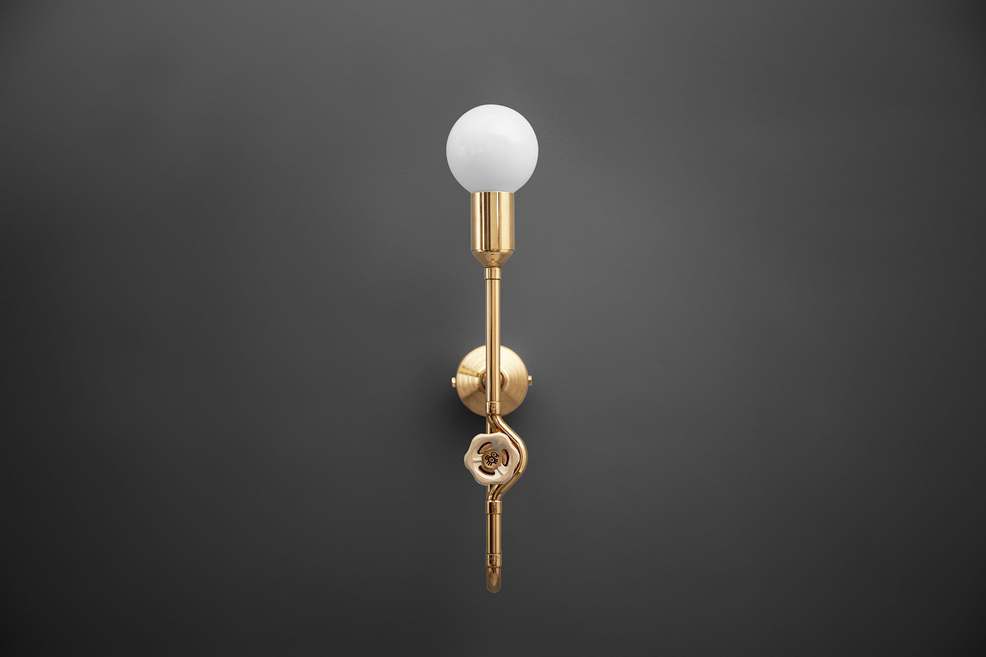 Brass dimmable sconce with vintage ivory knob