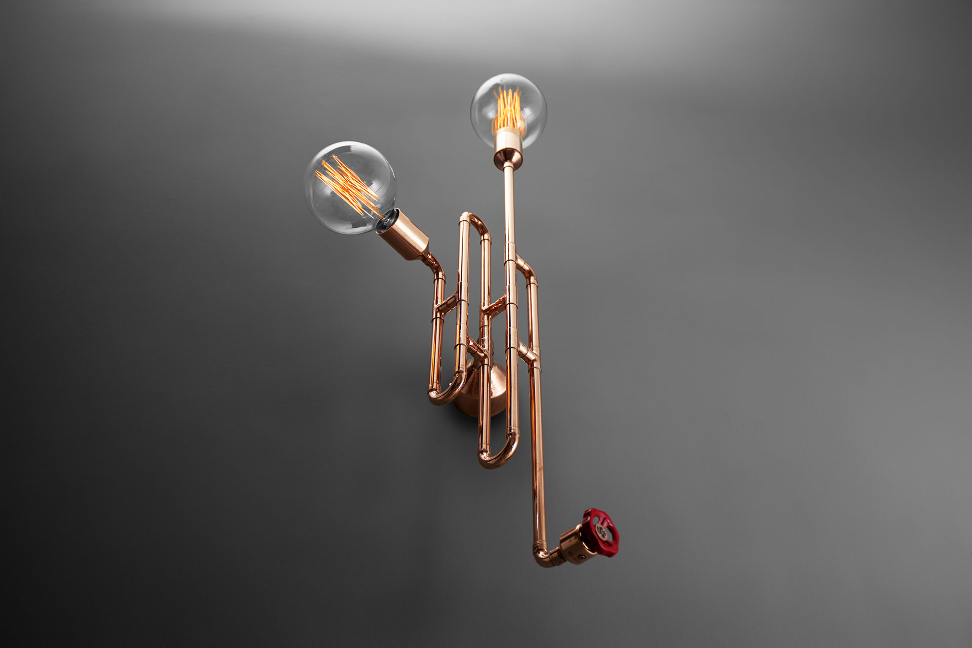 Unique copper designers sconce in loft style restaurant