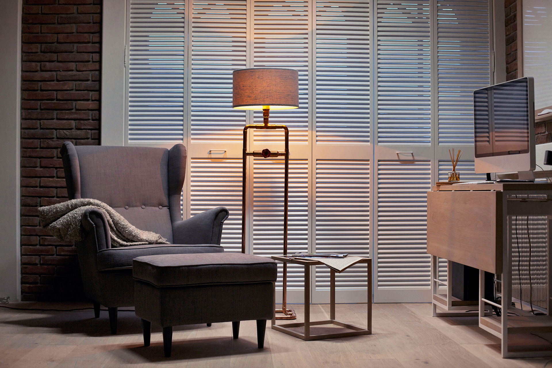 Industrial design floor lamp in trendy copper or modern brass in downtown loft apartment