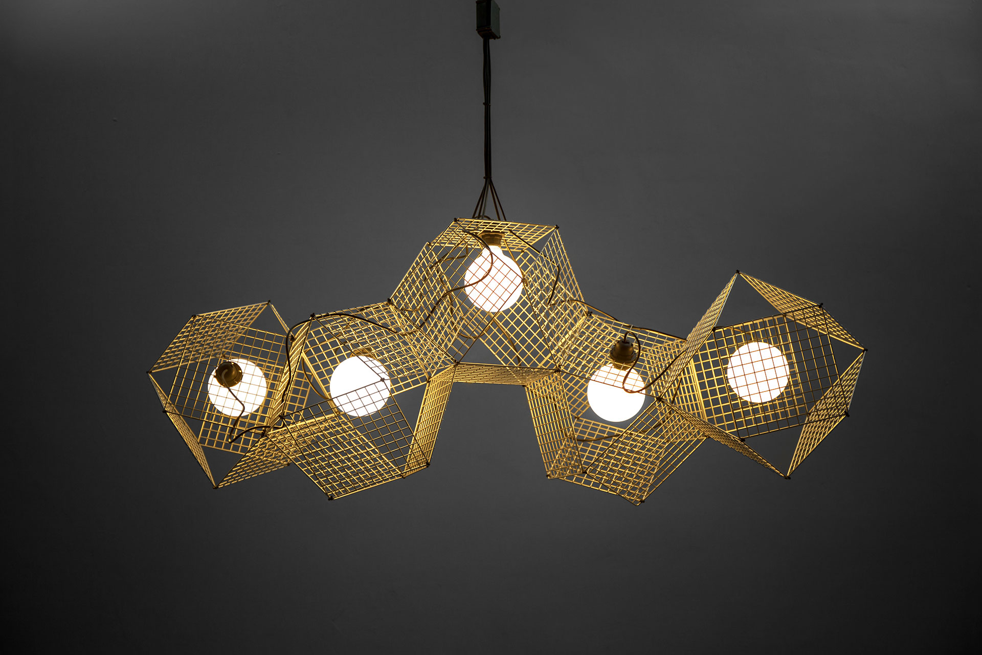 Unique brass ceiling lamp in trendy gold color inspired by modern geometric design