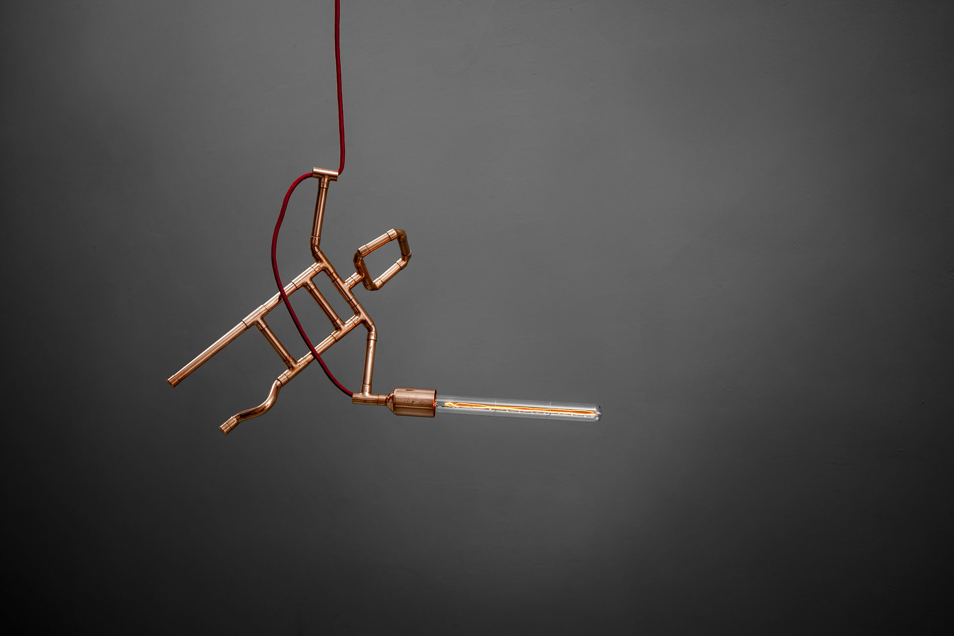Designer pipe guy pendant lamp in brass or copper inspired by loft design
