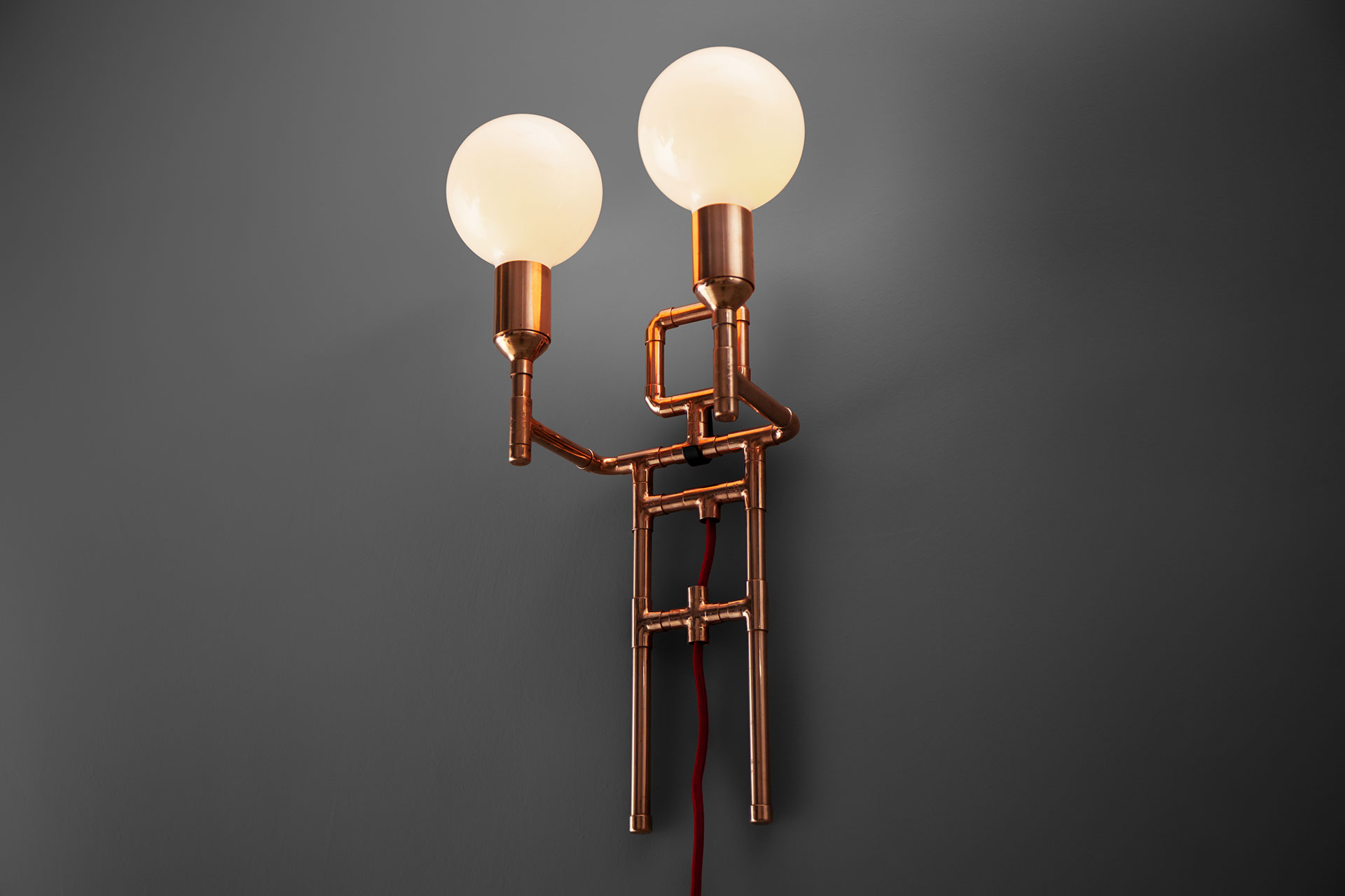 Cool designers sconce in copper or brass