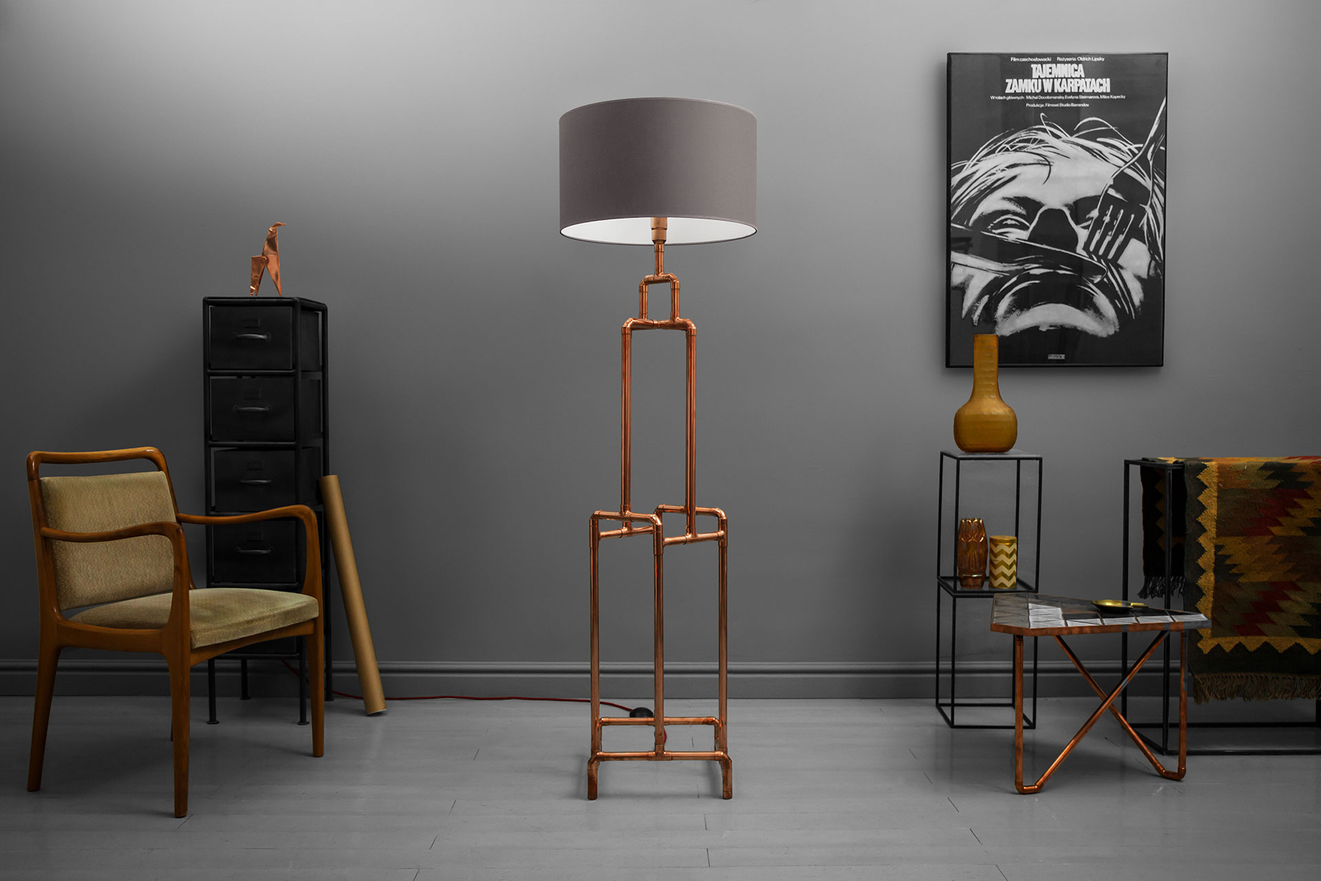 Loft style floor lamp made of copper pipes in trendy hipster apartment