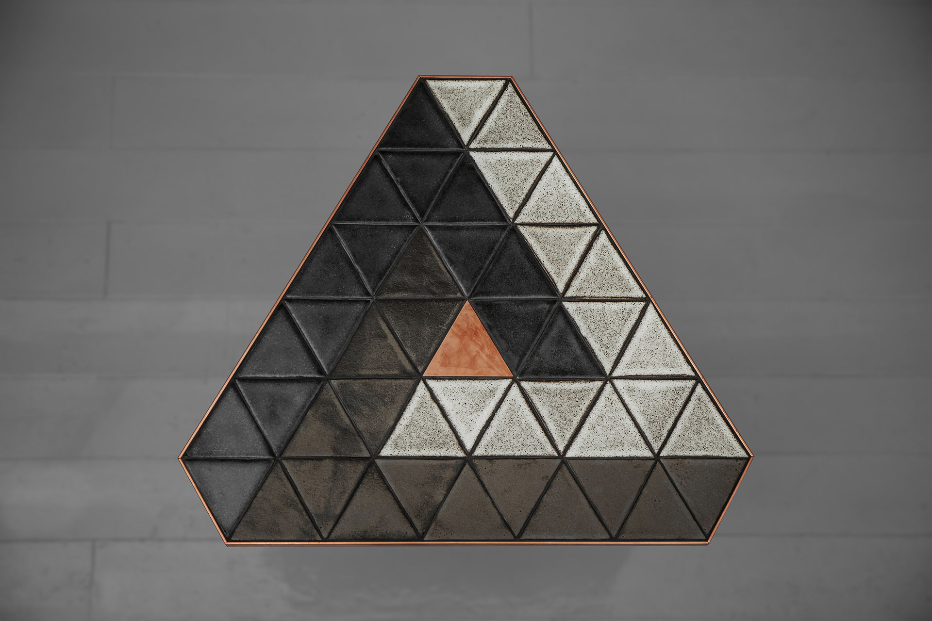 Ceramic side table inspired by Penrose triangle