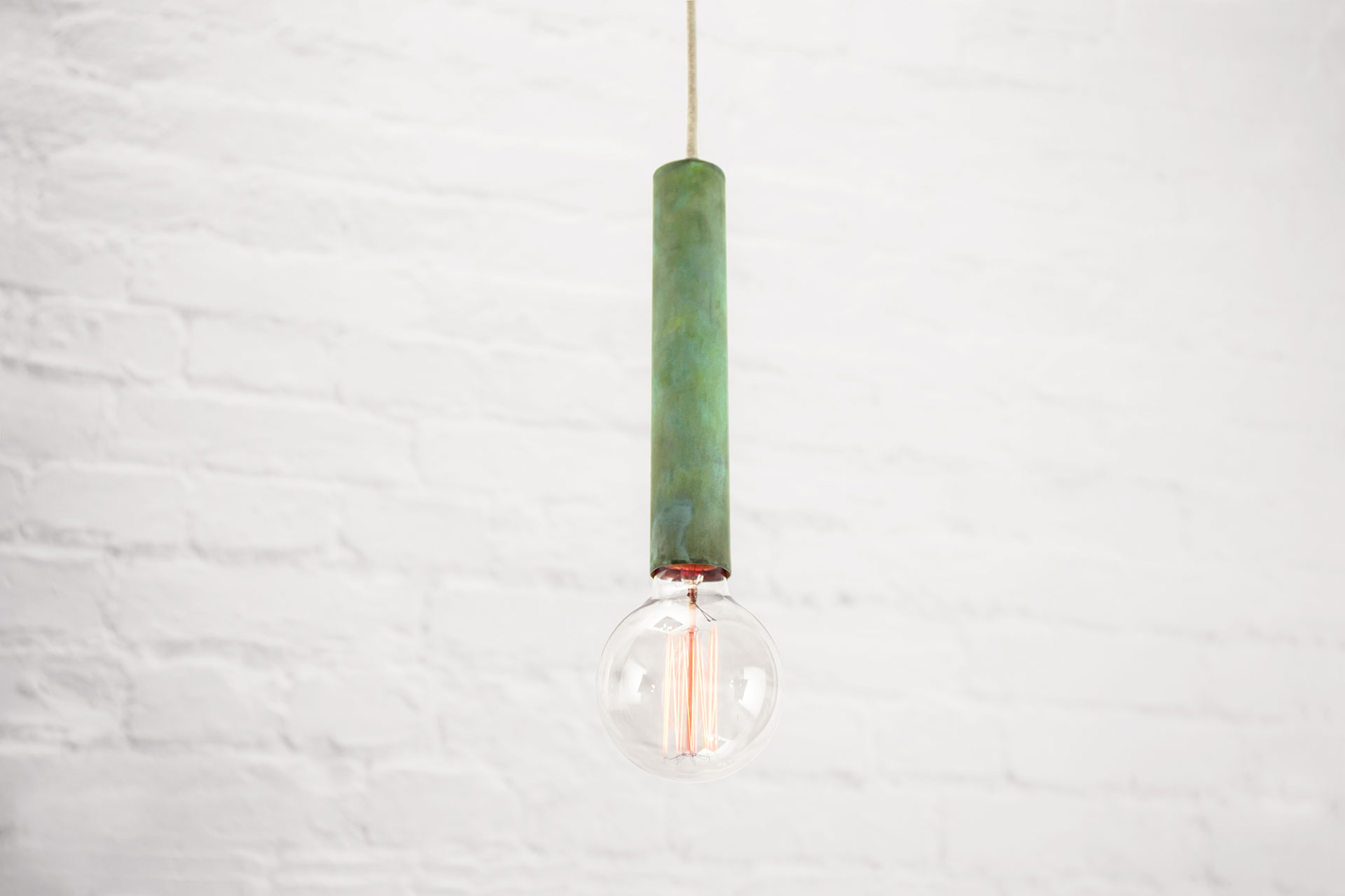 Trendy green patina pendant lamp in chic apartment