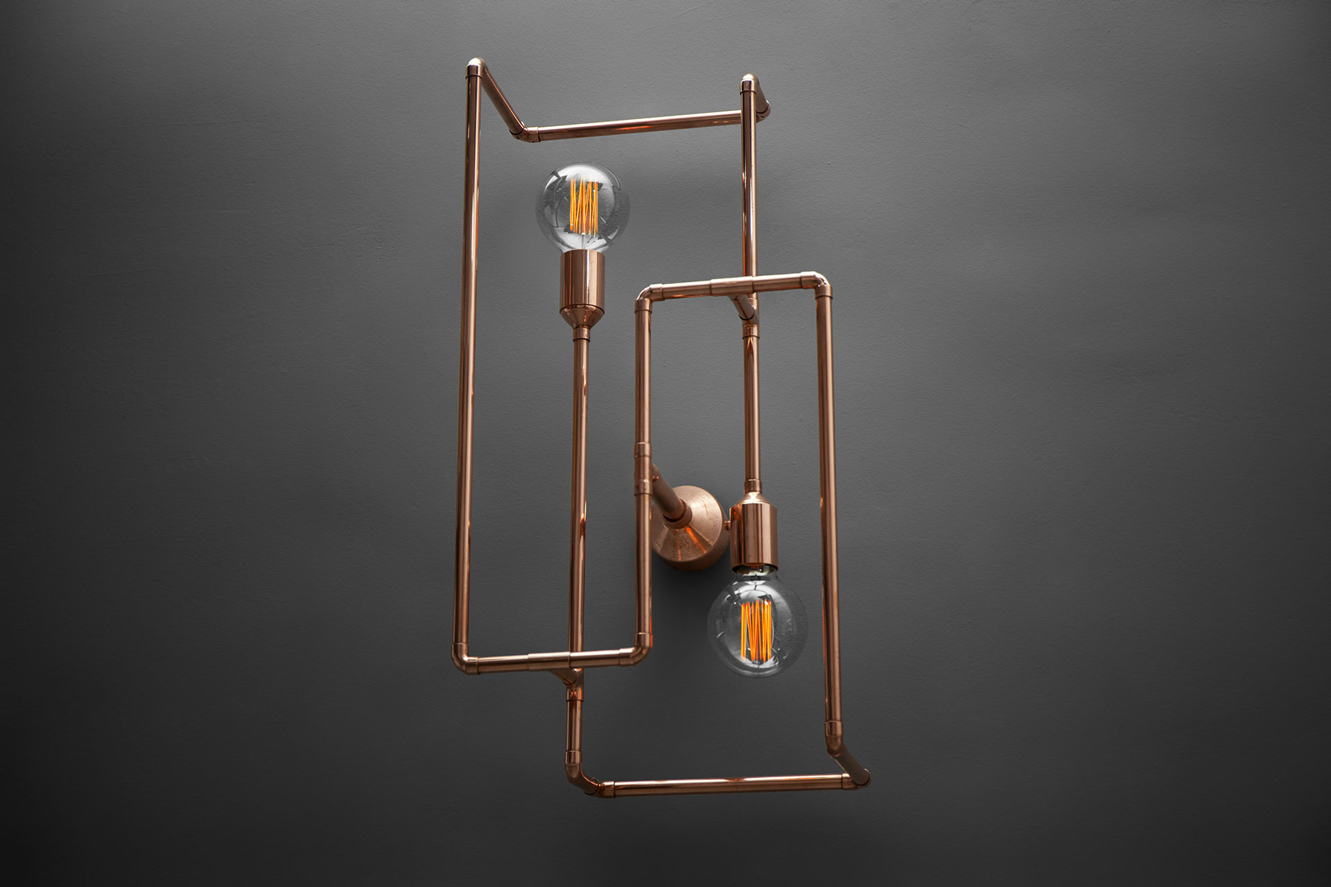 Large decorative copper sconce in loft style restaurant