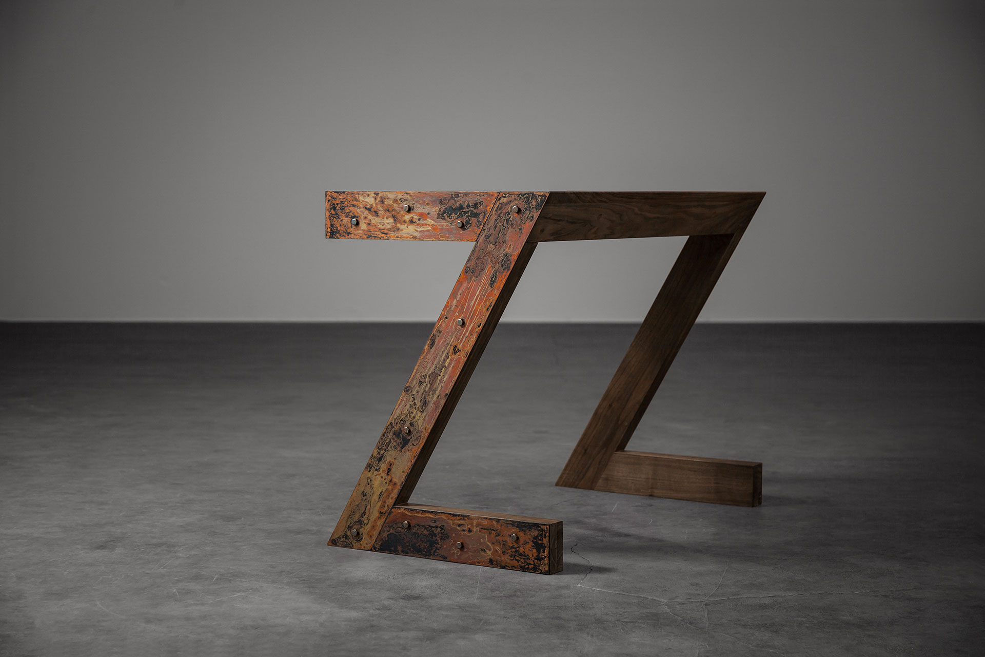Brutalist design desk in walnut wood and rust metal