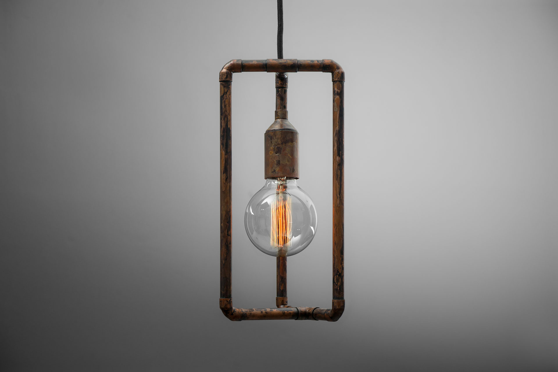 Rusty pendant lamp with vintage Edison bulb inspired by industrial design