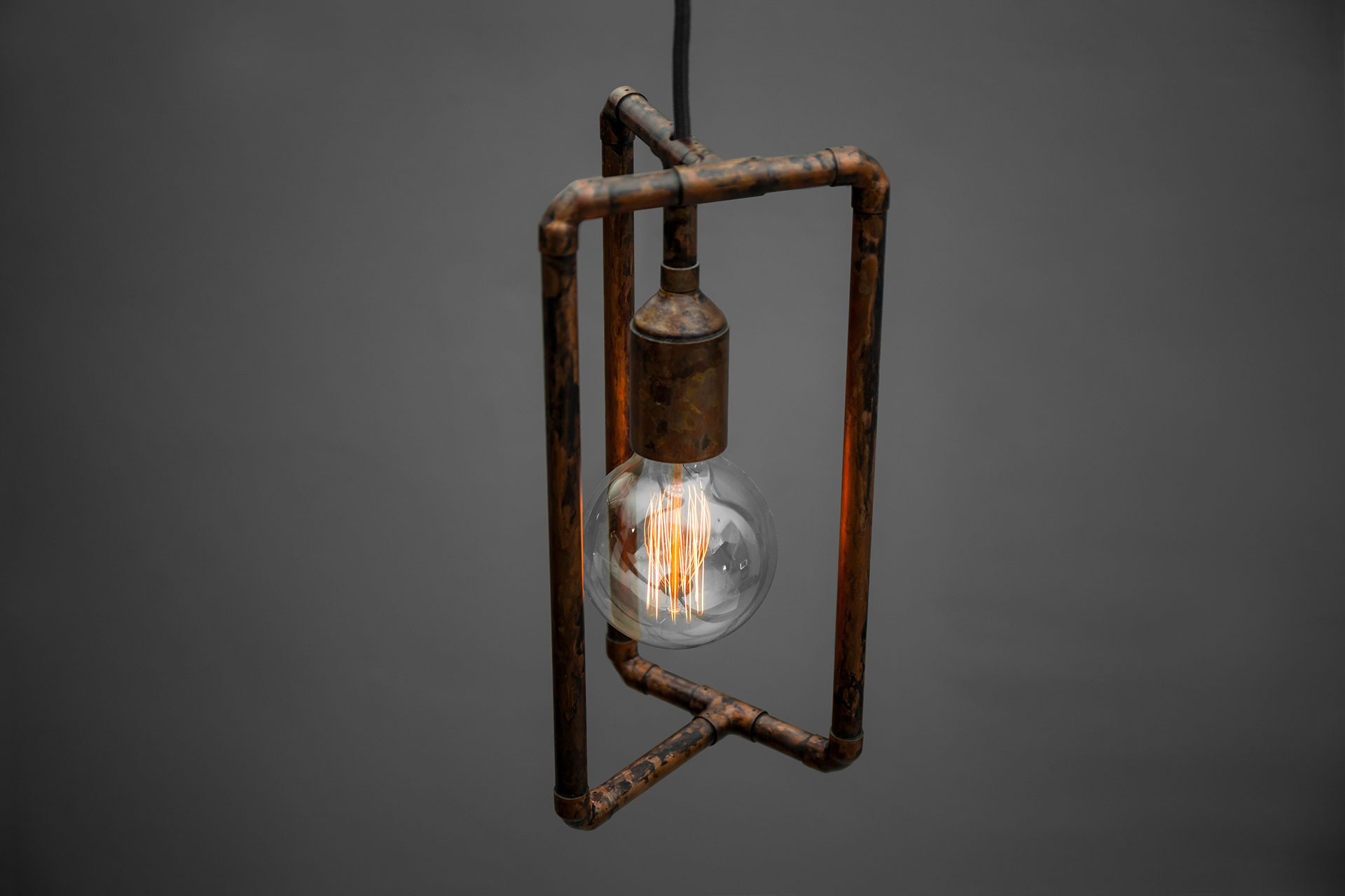 Vintage industrial ceiling lamp in aged copper metal finish