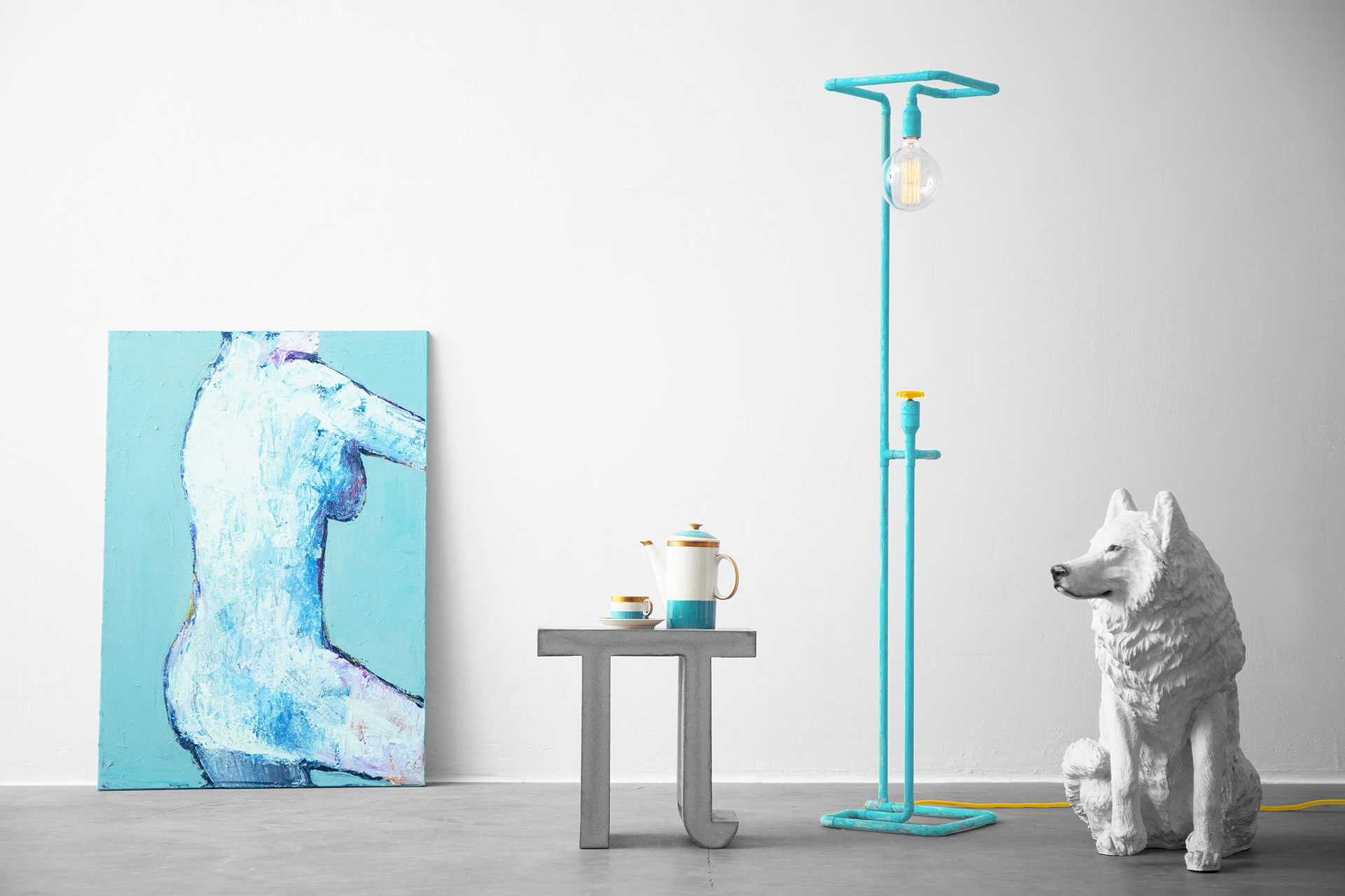 Unique dimmable floor lamp in colorful turquoise patina in trendy loft apartment