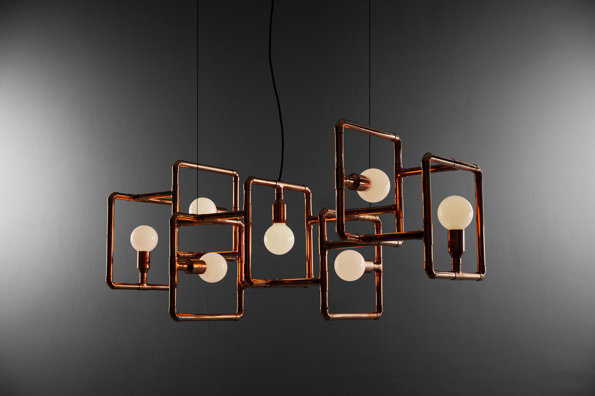 Conceptual design ceiling lamp made of copper tubing in industrial style interior