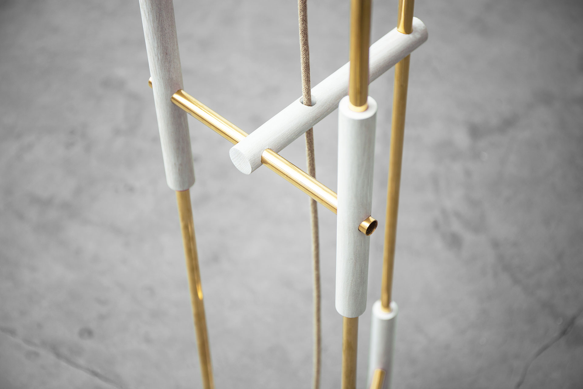 Modern design floor lamp in gold brass and white wood inspired by the art of the Japanese joinery