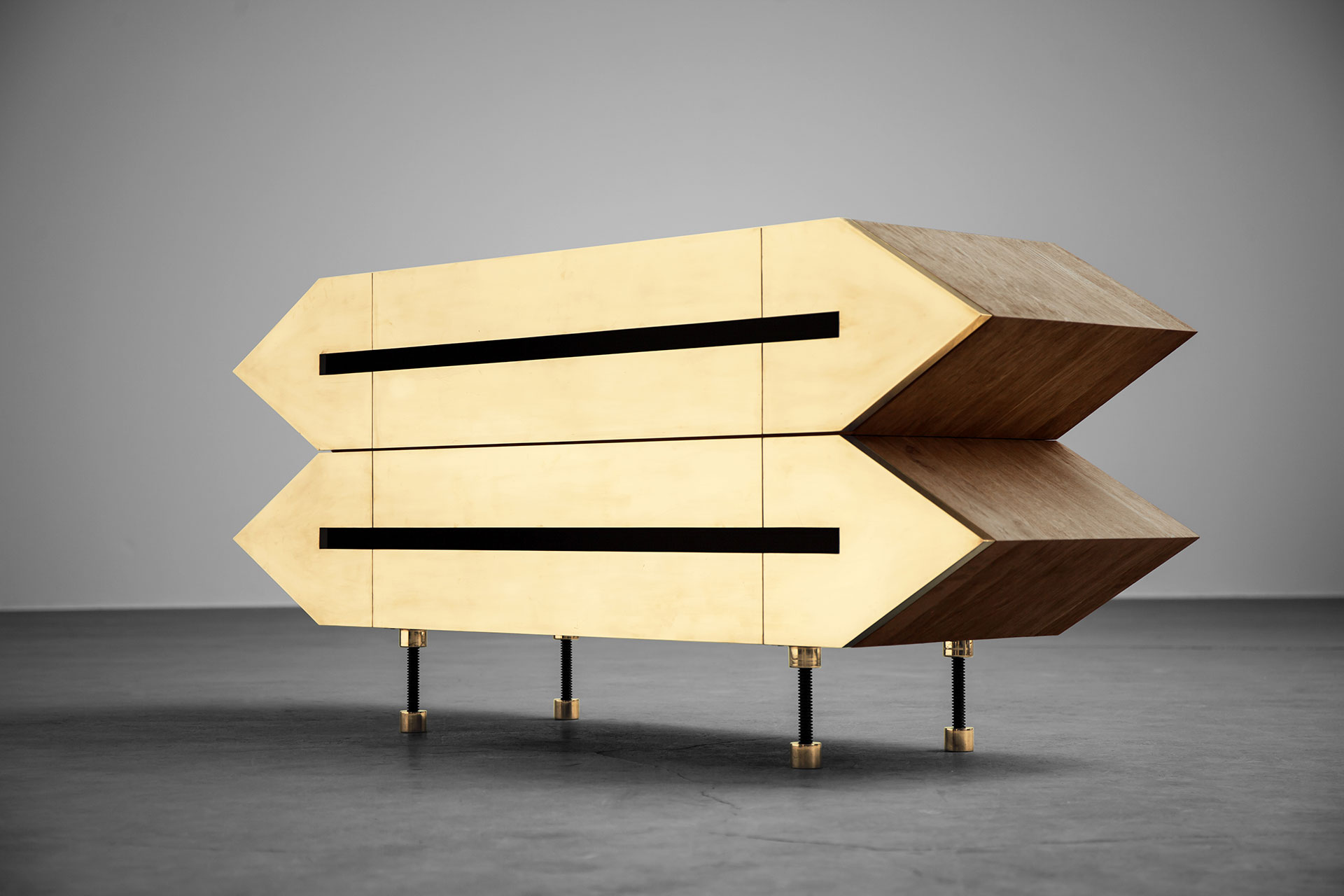 Brutalist design sideboard with brass doors inspired by futuristic architecture