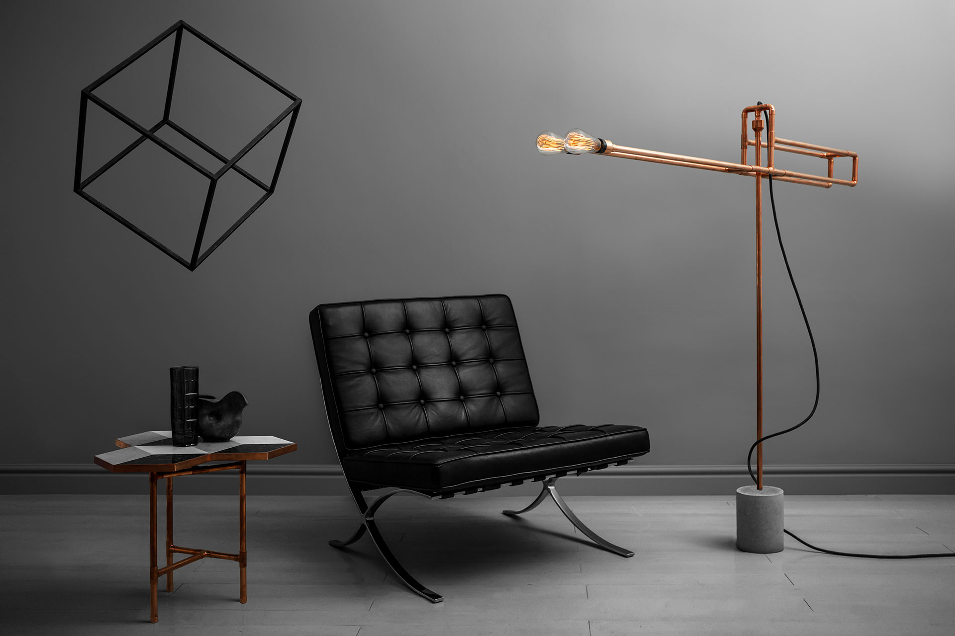 Industrial design floor lamp made of copper and concrete in loft style men's apartment