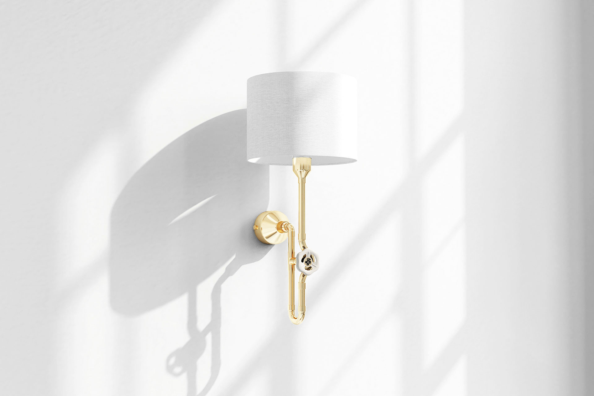 Contemporary wall lamp in trendy brass metal finish with vintage ivory knob and white linen shade in light bedroom