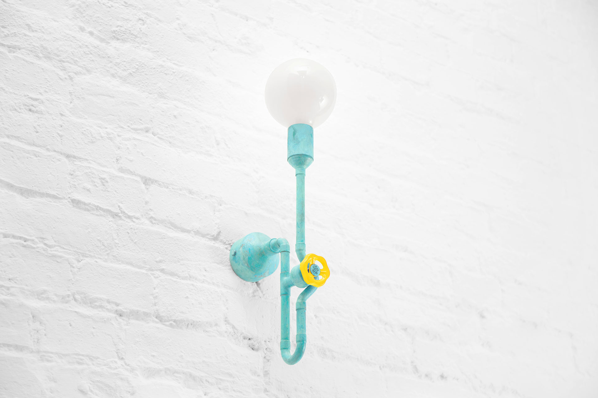 Modern design turquoise sconce in urban chic apartment