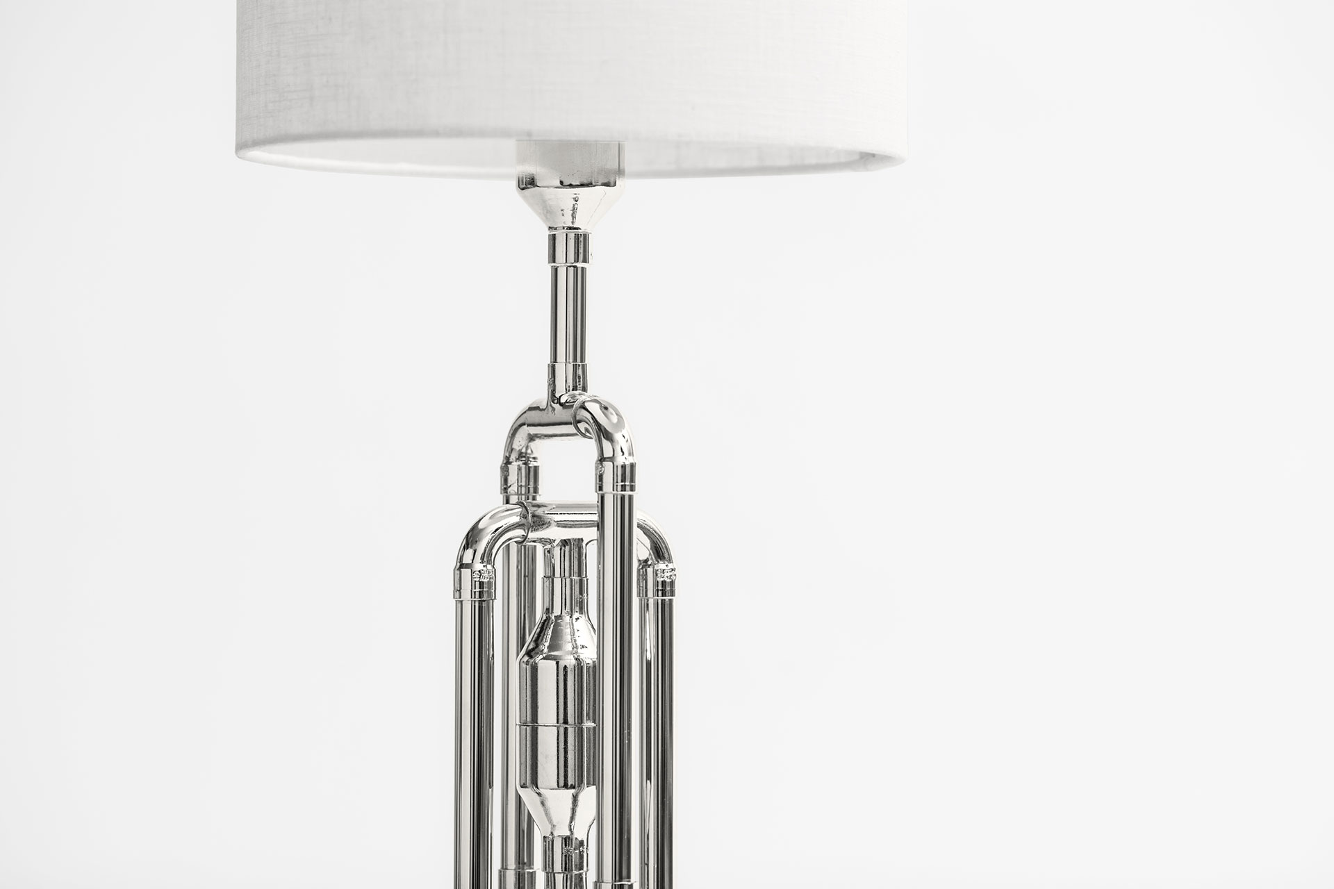 Nickel plated console lamp with white natural linen shade inspired by Art Deco design